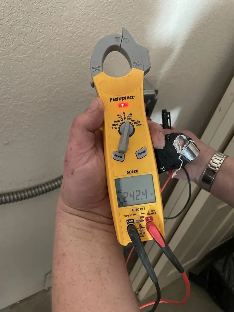 Voltage testing with clamp meter during Outlet Installation in Greer